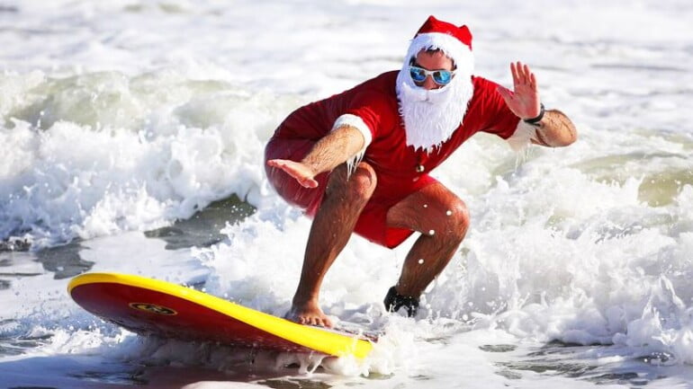 santa on a surf board